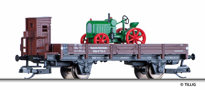 [Nákladní vozy] → [Nízkostěnné] → [2-osé X] → 501698: nízkostěnný vůz červenohnědý s brzdařskou budkou a nákladem traktoru